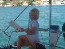 Valerie looking in the fish book to identify some of the fish she saw while snorkling